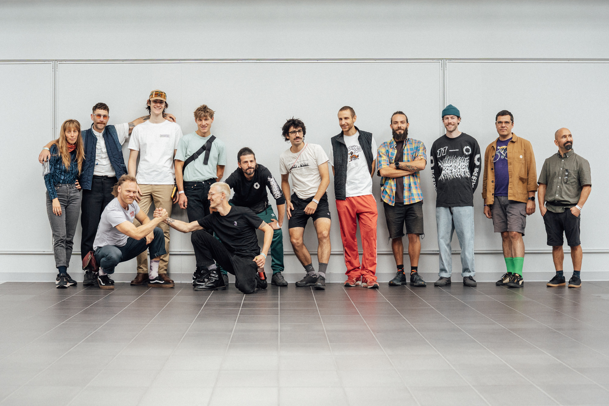A group of builders and makers standing together against a white wall at the show