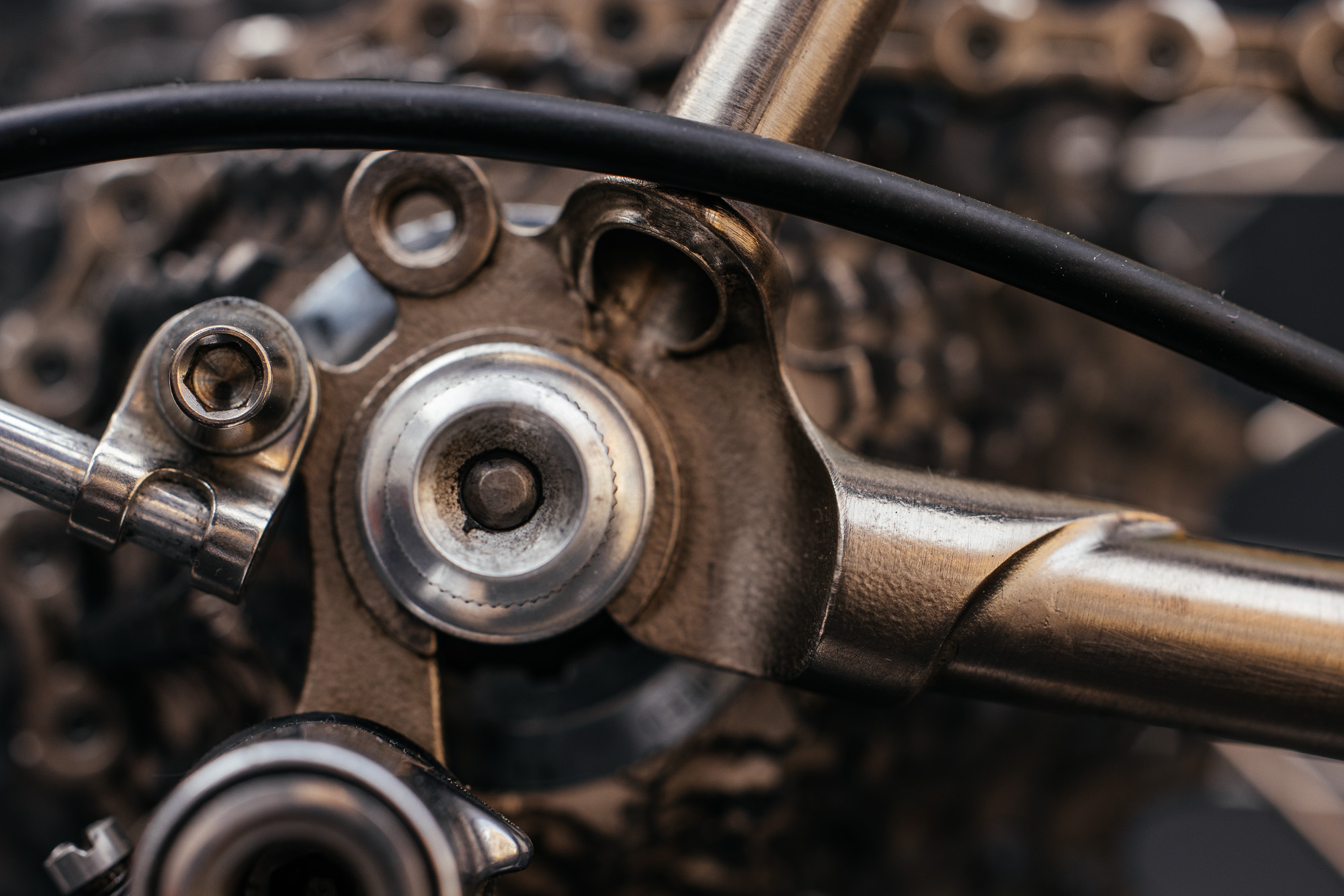 Macro detail of a hand-brazed bottom bracket junction on a Julius randonneur frame