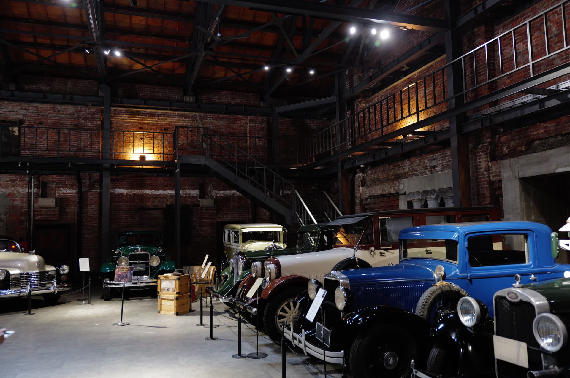 Vintage cars displayed inside the GLION venue in Osaka